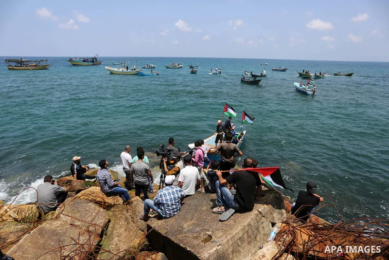 Palestinian activists ride fishing boats as they protesting and perhaps trying to breach Israel's naval blockade on Gaza, setting to sail from Gaza City harbour towards Europe on May 29, 2018. Palestinians in Gaza are pl...