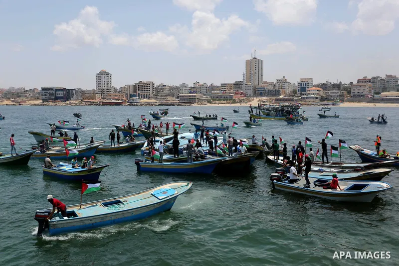 Palestinian activists ride fishing boats as they protesting and perhaps trying to breach Israel's naval blockade on Gaza, setting to sail from Gaza City harbour towards Europe on May 29, 2018. Palestinians in Gaza are pl...