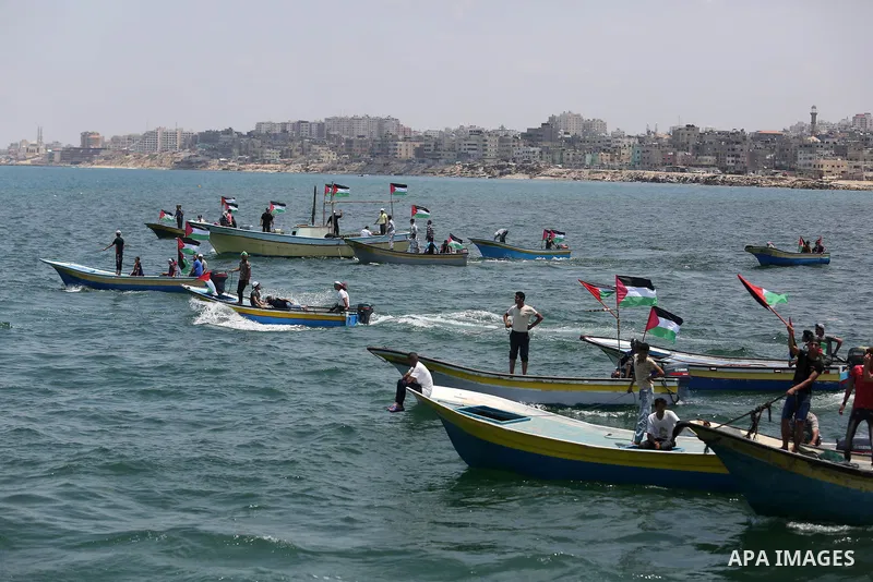 Palestinian activists ride fishing boats as they protesting and perhaps trying to breach Israel's naval blockade on Gaza, setting to sail from Gaza City harbour towards Europe on May 29, 2018. Palestinians in Gaza are pl...