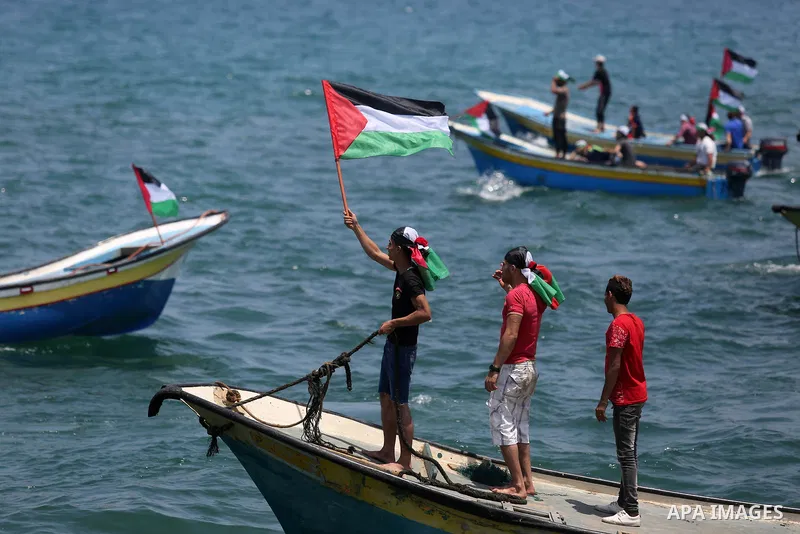 Palestinian activists ride fishing boats as they protesting and perhaps trying to breach Israel's naval blockade on Gaza, setting to sail from Gaza City harbour towards Europe on May 29, 2018. Palestinians in Gaza are pl...