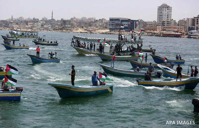 Palestinian activists ride fishing boats as they protesting and perhaps trying to breach Israel's naval blockade on Gaza, setting to sail from Gaza City harbour towards Europe on May 29, 2018. Palestinians in Gaza are pl...