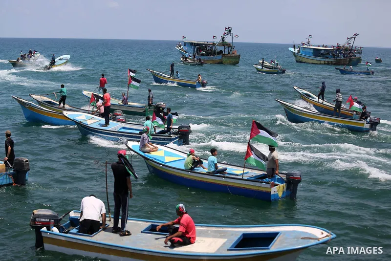 Palestinian activists ride fishing boats as they protesting and perhaps trying to breach Israel's naval blockade on Gaza, setting to sail from Gaza City harbour towards Europe on May 29, 2018. Palestinians in Gaza are pl...
