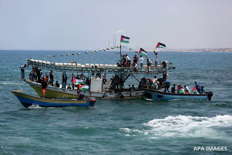 Palestinian activists ride fishing boats as they protesting and perhaps trying to breach Israel's naval blockade on Gaza, setting to sail from Gaza City harbour towards Europe on May 29, 2018. Palestinians in Gaza are pl...