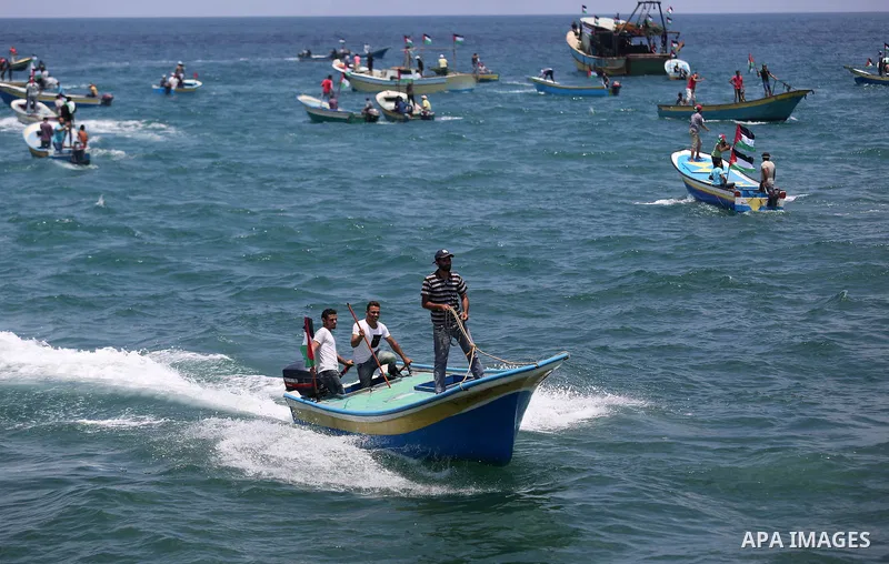 Palestinian activists ride fishing boats as they protesting and perhaps trying to breach Israel's naval blockade on Gaza, setting to sail from Gaza City harbour towards Europe on May 29, 2018. Palestinians in Gaza are pl...