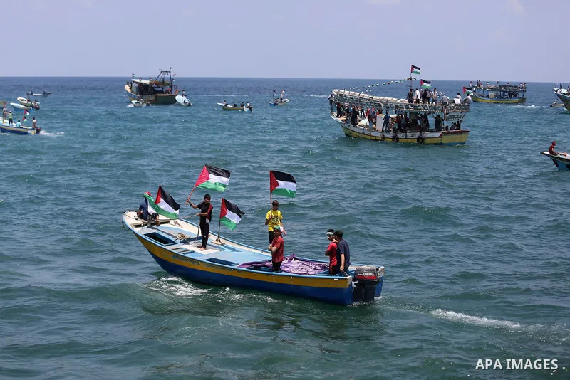 Palestinian activists ride fishing boats as they protesting and perhaps trying to breach Israel's naval blockade on Gaza, setting to sail from Gaza City harbour towards Europe on May 29, 2018. Palestinians in Gaza are pl...