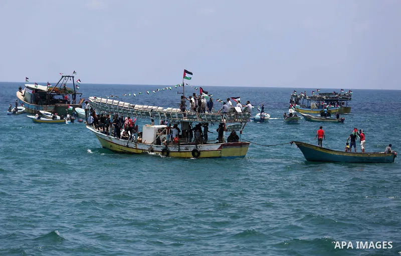 Palestinian activists ride fishing boats as they protesting and perhaps trying to breach Israel's naval blockade on Gaza, setting to sail from Gaza City harbour towards Europe on May 29, 2018. Palestinians in Gaza are pl...