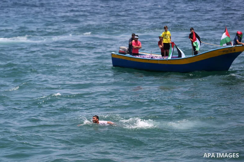 Palestinian activists ride fishing boats as they protesting and perhaps trying to breach Israel's naval blockade on Gaza, setting to sail from Gaza City harbour towards Europe on May 29, 2018. Palestinians in Gaza are pl...