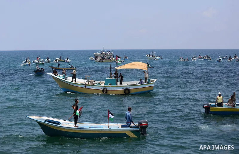 Palestinian activists ride fishing boats as they protesting and perhaps trying to breach Israel's naval blockade on Gaza, setting to sail from Gaza City harbour towards Europe on May 29, 2018. Palestinians in Gaza are pl...