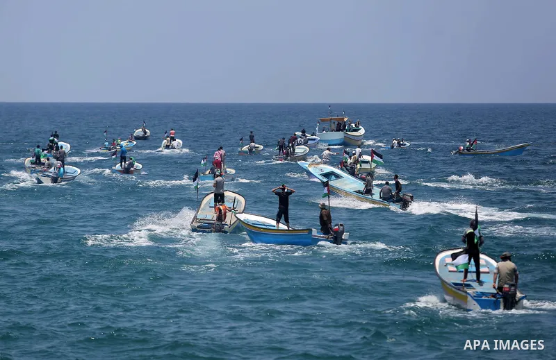 Palestinian activists ride fishing boats as they protesting and perhaps trying to breach Israel's naval blockade on Gaza, setting to sail from Gaza City harbour towards Europe on May 29, 2018. Palestinians in Gaza are pl...