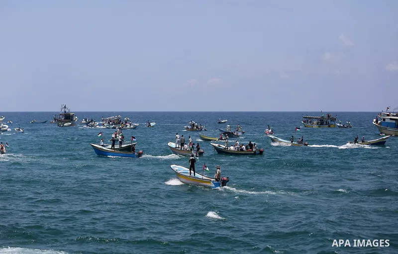 Palestinian activists ride fishing boats as they protesting and perhaps trying to breach Israel's naval blockade on Gaza, setting to sail from Gaza City harbour towards Europe on May 29, 2018. Palestinians in Gaza are pl...
