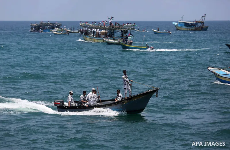 Palestinian activists ride fishing boats as they protesting and perhaps trying to breach Israel's naval blockade on Gaza, setting to sail from Gaza City harbour towards Europe on May 29, 2018. Palestinians in Gaza are pl...