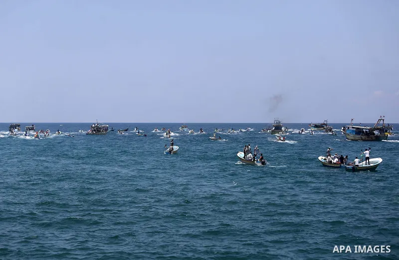 Palestinian activists ride fishing boats as they protesting and perhaps trying to breach Israel's naval blockade on Gaza, setting to sail from Gaza City harbour towards Europe on May 29, 2018. Palestinians in Gaza are pl...
