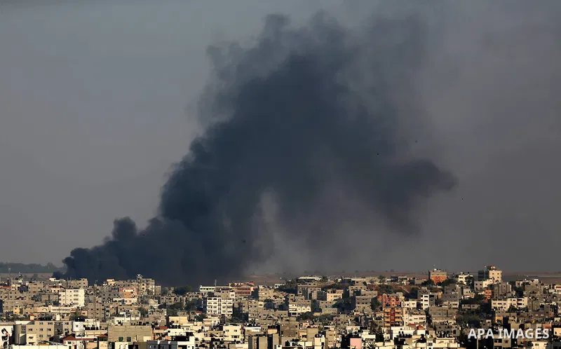 A picture taken from Gaza City on May 29, 2018, shows a smoke billowing in the background following an Israeli air strike on the Palestinian enclave. The Israeli military launched a series of air strikes on Palestinian p...