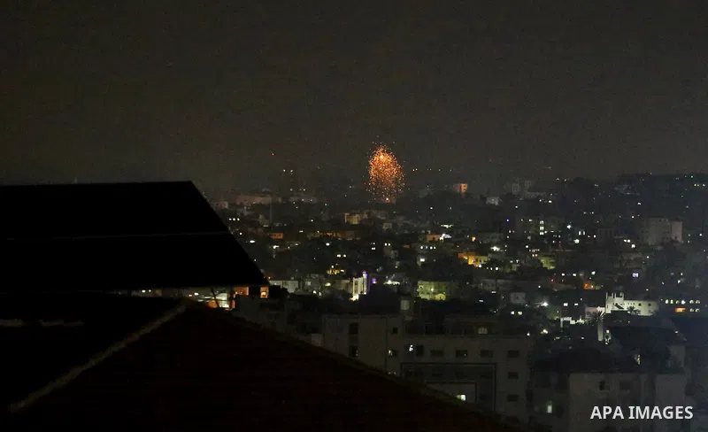 A picture taken from Gaza City on May 30, 2018, shows a fire and smoke billowing in the background following an Israeli air strike on the Palestinian enclave. The Israeli Defense Forces (IDF) said it launched more than 3...
