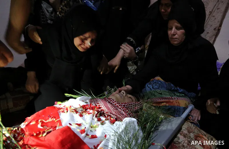 Relatives of Palestinian Naji Ghneim, 23, who died of his wounds endured during clashes with Israeli troops in a tent city protest where Palestinians demand the right to return to their homeland at the Israel-Gaza border...