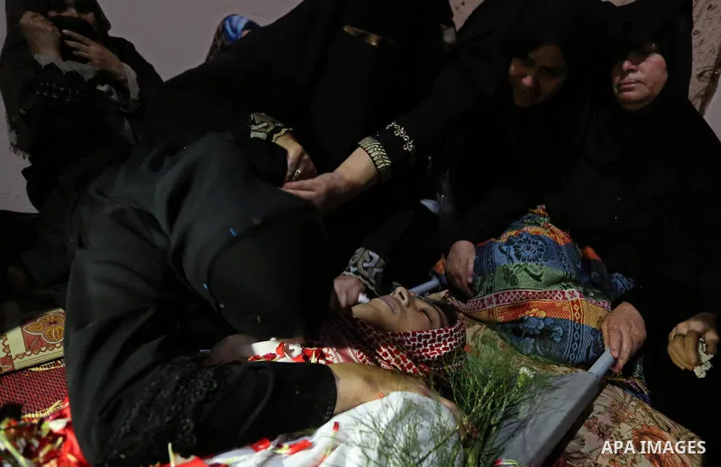 Relatives of Palestinian Naji Ghneim, 23, who died of his wounds endured during clashes with Israeli troops in a tent city protest where Palestinians demand the right to return to their homeland at the Israel-Gaza border...