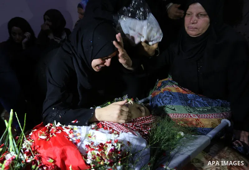 Relatives of Palestinian Naji Ghneim, 23, who died of his wounds endured during clashes with Israeli troops in a tent city protest where Palestinians demand the right to return to their homeland at the Israel-Gaza border...