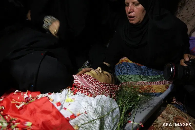 Relatives of Palestinian Naji Ghneim, 23, who died of his wounds endured during clashes with Israeli troops in a tent city protest where Palestinians demand the right to return to their homeland at the Israel-Gaza border...