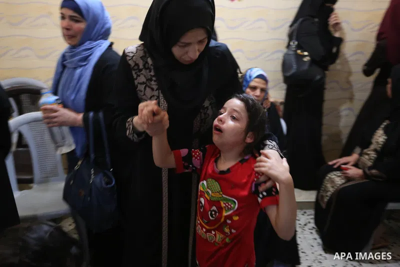 Relatives of Palestinian Naji Ghneim, 23, who died of his wounds endured during clashes with Israeli troops in a tent city protest where Palestinians demand the right to return to their homeland at the Israel-Gaza border...