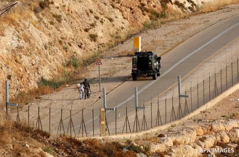 Israeli policemen detain a Palestinian youths as other try to make their way to attend the third Friday prayer of the holy fasting month of Ramadan in Jerusalem's Al-Aqsa mosque, after Israeli police prevented them from...