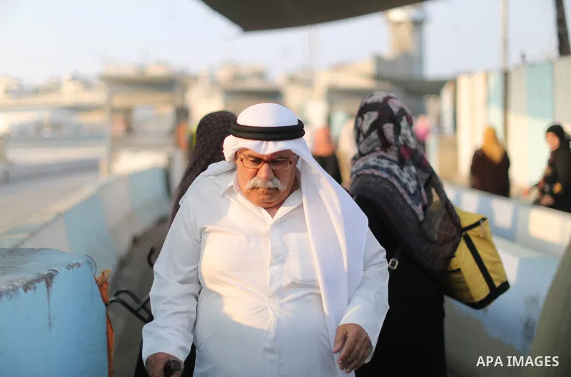Palestinians make their way through Qalandia checkpoint to attend the third Friday prayer of the holy fasting month of Ramadan in Jerusalem's Al-Aqsa mosque, near Ramallah in the occupied West Bank, on June 1, 2018. Rama...