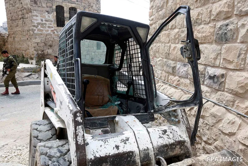 Israeli soldiers gather at the scene of what the Israeli military said was car-ramming attacks by a Palestinian man in the West Bank city of Hebron on June 2, 2018. The Israeli army shot dead Rami Sabarneh, 36, in the Ja...