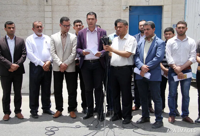 Palestinian Yasser Al-Dirawi a member of human rights organizations speaks during a press conference in front of the high commissioner for human rights headquarters, in Gaza city on June 2, 2018. Photo by Mahmoud Ajour