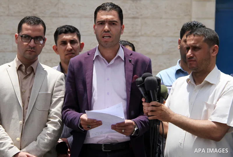 Palestinian Yasser Al-Dirawi a member of human rights organizations speaks during a press conference in front of the high commissioner for human rights headquarters, in Gaza city on June 2, 2018. Photo by Mahmoud Ajour