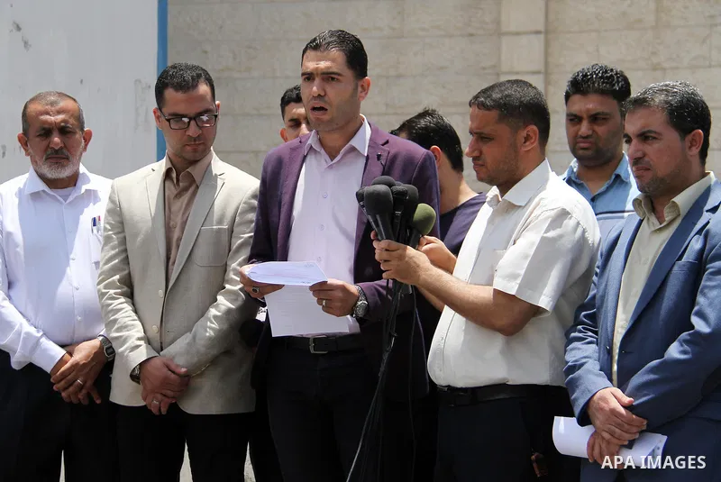 Palestinian Yasser Al-Dirawi a member of human rights organizations speaks during a press conference in front of the high commissioner for human rights headquarters, in Gaza city on June 2, 2018. Photo by Mahmoud Ajour