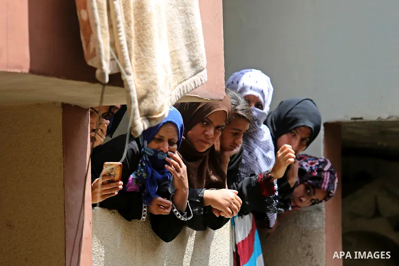 Relatives of Palestinian nurse Razan Al-Najar, 21, mourn during her funeral after she was shot dead by Israeli soldiers, in Khan Younis in the southern Gaza strip on June 2, 2018. Najar, a volunteer medic, was shot by Is...