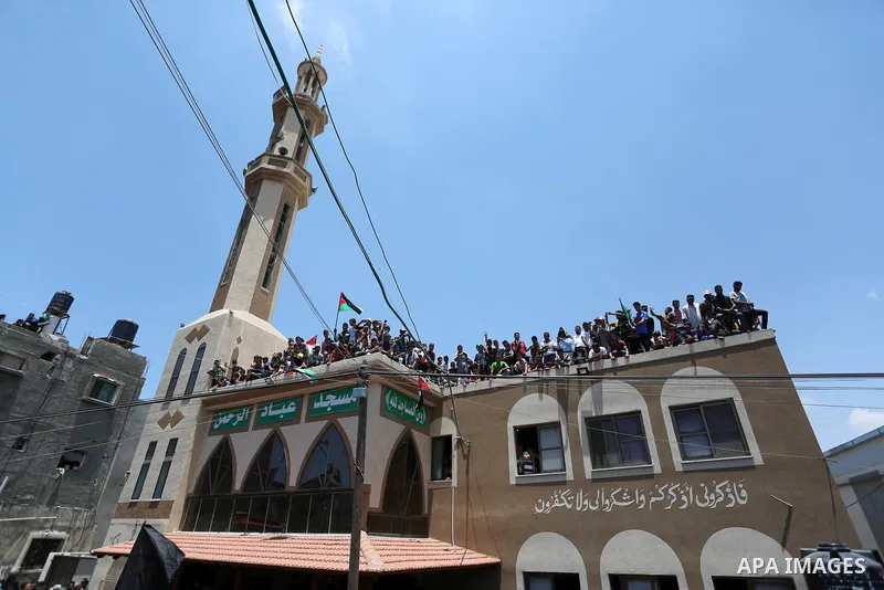 Palestinian mourners attend the funeral of Razan Al-Najar, 21, after she was shot dead by Israeli soldiers, in Khan Younis in the southern Gaza strip on June 2, 2018. Najar, a volunteer medic, was shot by Israeli forces...