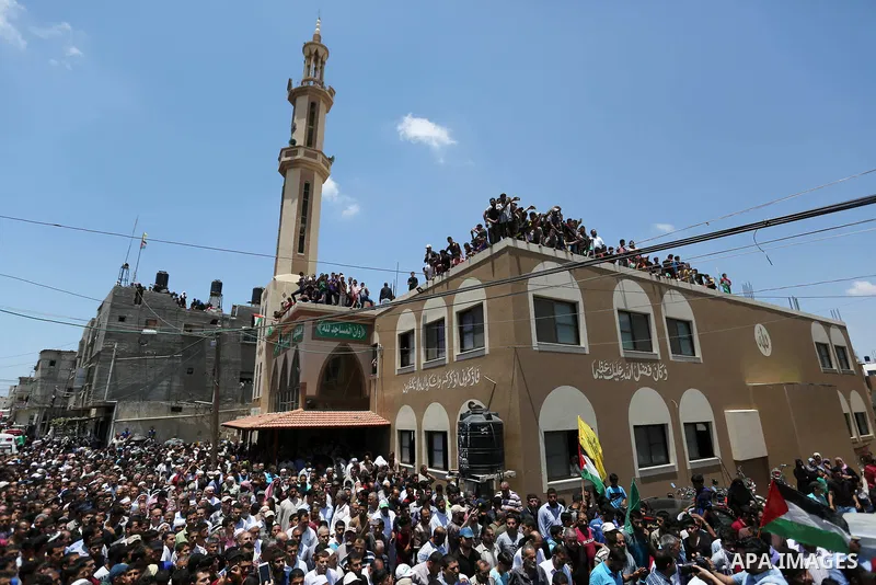 Palestinian mourners attend the funeral of Razan Al-Najar, 21, after she was shot dead by Israeli soldiers, in Khan Younis in the southern Gaza strip on June 2, 2018. Najar, a volunteer medic, was shot by Israeli forces...