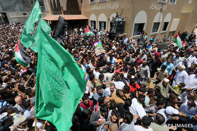 Palestinian mourners carry the body of nurse Razan Al-Najar, 21, during her funeral after she was shot dead by Israeli soldiers, in Khan Younis in the southern Gaza strip on June 2, 2018. Najar, a volunteer medic, was sh...
