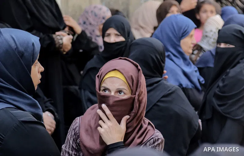 Relatives of Palestinian nurse Razan Al-Najar, 21, mourn during her funeral after she was shot dead by Israeli soldiers, in Khan Younis in the southern Gaza strip on June 2, 2018. Najar, a volunteer medic, was shot by Is...
