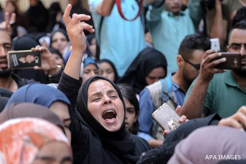 Relatives of Palestinian nurse Razan Al-Najar, 21, mourn during her funeral after she was shot dead by Israeli soldiers, in Khan Younis in the southern Gaza strip on June 2, 2018. Najar, a volunteer medic, was shot by Is...