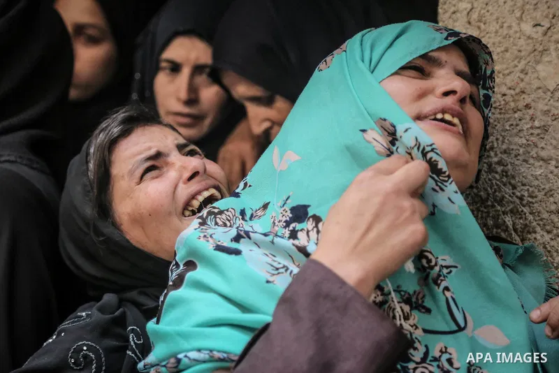 Relatives of Palestinian nurse Razan Al-Najar, 21, mourn during her funeral after she was shot dead by Israeli soldiers, in Khan Younis in the southern Gaza strip on June 2, 2018. Najar, a volunteer medic, was shot by Is...