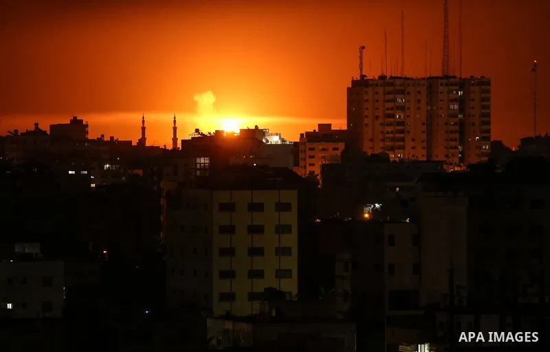 A picture taken from Gaza City on June 3, 2018, shows a smoke billowing in the background following an Israeli air strike on the Palestinian enclave. Photo by Dawoud Abo Alkas