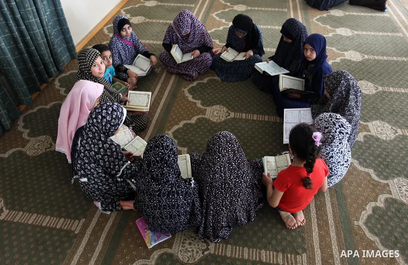 Palestinian girls attend a lesson of Koran, Islam's holiest book on the Muslim holy fasting month of Ramadan, at a Mosque in Gaza city, June 3, 2018. Ramadan is sacred to Muslims because it is during that month that trad...
