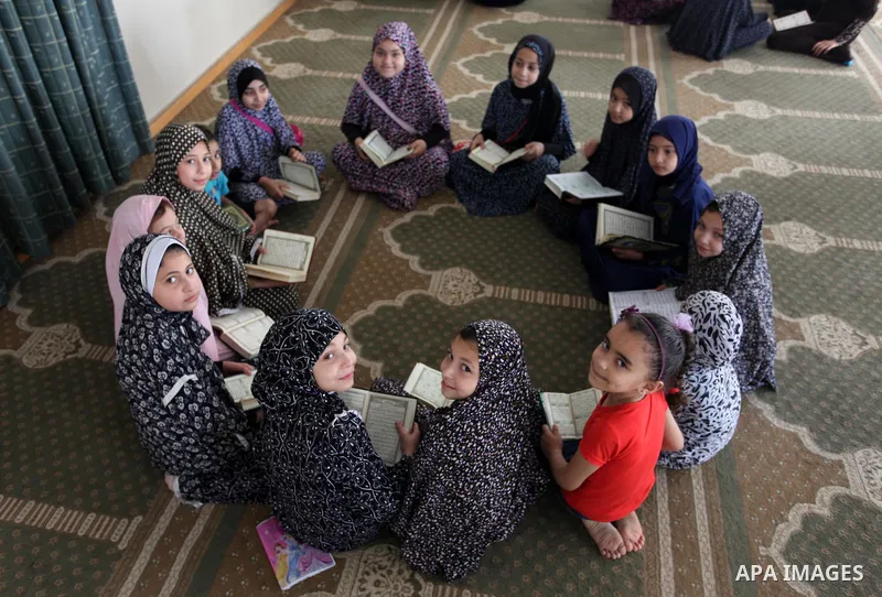 Palestinian girls attend a lesson of Koran, Islam's holiest book on the Muslim holy fasting month of Ramadan, at a Mosque in Gaza city, June 3, 2018. Ramadan is sacred to Muslims because it is during that month that trad...