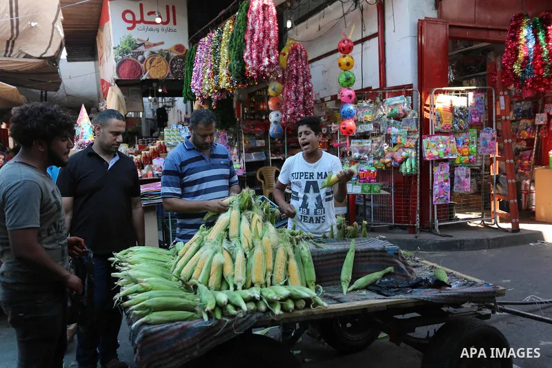 Palestinians shop at a market during the holy fasting month of Ramadan in Gaza city, on June 4, 2018. Ramadan is sacred to Muslims because it is during that month that tradition says the Koran was revealed to the Prophet...