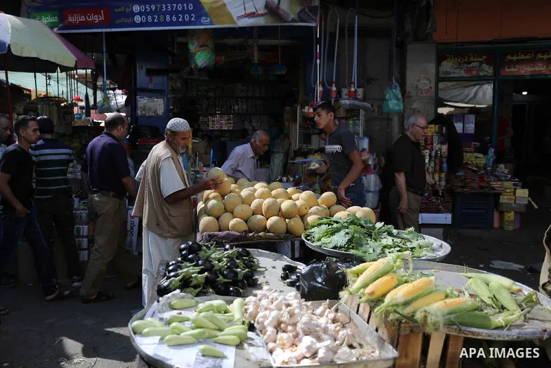 Palestinians shop at a market during the holy fasting month of Ramadan in Gaza city, on June 4, 2018. Ramadan is sacred to Muslims because it is during that month that tradition says the Koran was revealed to the Prophet...