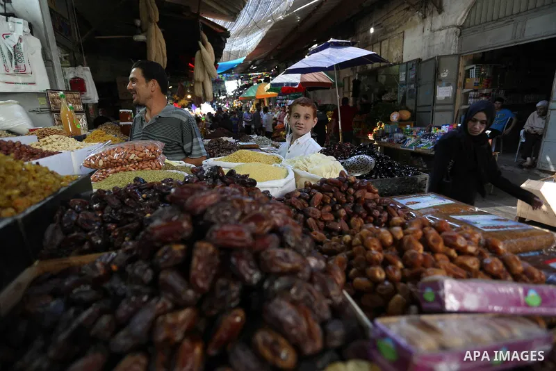Palestinians shop at a market during the holy fasting month of Ramadan in Gaza city, on June 4, 2018. Ramadan is sacred to Muslims because it is during that month that tradition says the Koran was revealed to the Prophet...
