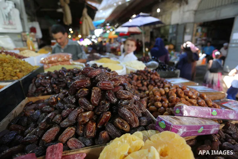 Palestinians shop at a market during the holy fasting month of Ramadan in Gaza city, on June 4, 2018. Ramadan is sacred to Muslims because it is during that month that tradition says the Koran was revealed to the Prophet...
