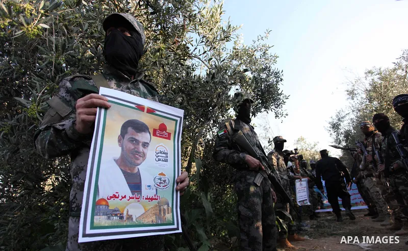 Palestinian militants of al-Nasser Salah al-Deen Brigades, the military wing of the Popular Resistance Committees, take part in a protest to solidaratiy with Jerusalem, in Gaza city, on June 5, 2018. Photo by Mahmoud Ajo...