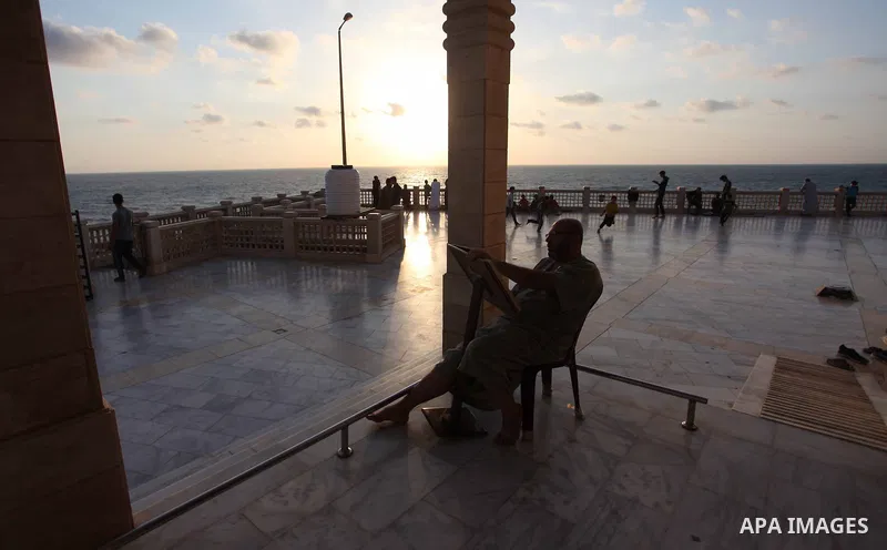 A Palestinian man reads the Koran, Islam's holiest book, at a mosque in Gaza City during the Muslim holy month of Ramadan, on June 6, 2018. Ramadan is sacred to Muslims because it is during that month that tradition says...