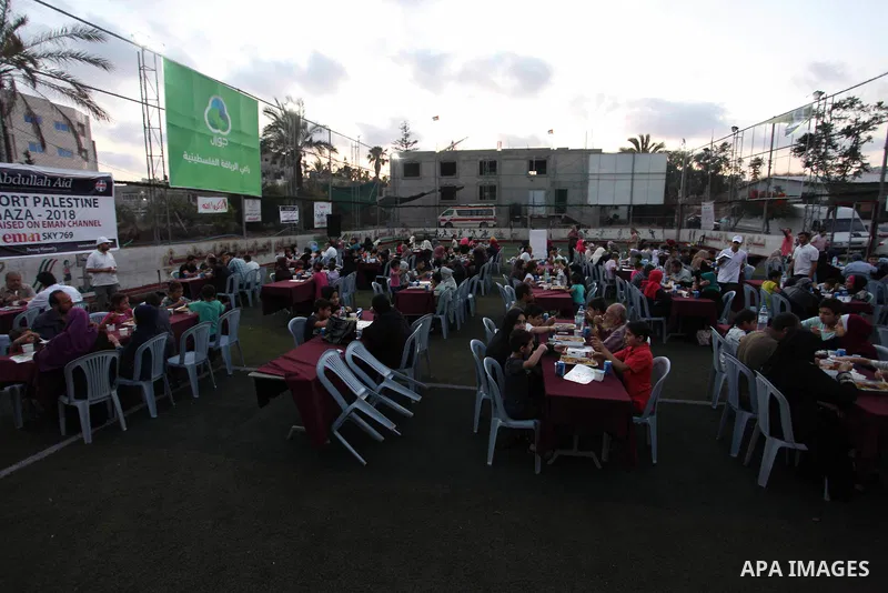 Palestinians break their fast on the Muslim holy fasting month of Ramadan in Gaza City, on June 6, 2018. Ramadan is sacred to Muslims because it is during that month that tradition says the Koran was revealed to the Prop...