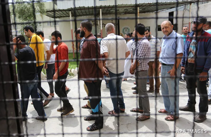 Palestinian prisoners leave the prison run by the Ministry of the Interior and National Security in Gaza Strip, in Dair Al Balah in the center of Gaza Strip on June 7, 2018. Security officials in Gaza Strip said on Thurs...