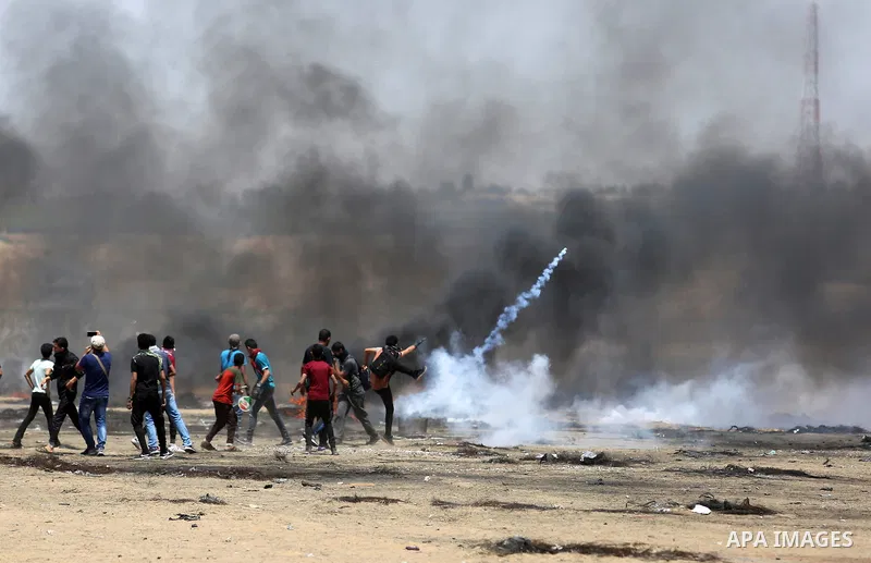 Palestinian protesters gather during clashes with Israeli troops in a protest marking al-Quds Day, (Jerusalem Day), at the Israel-Gaza border in Khan Younis in the southern Gaza Strip on June 8, 2018. Photo by Ashraf Amr...