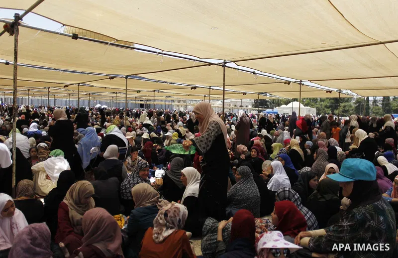 Palestinians gather to perform the last Friday prayers of the Muslim holy month of Ramadan at the Aqsa mosque compound in the old city of Jerusalem on June 8, 2018. Photo by Muammar Awad