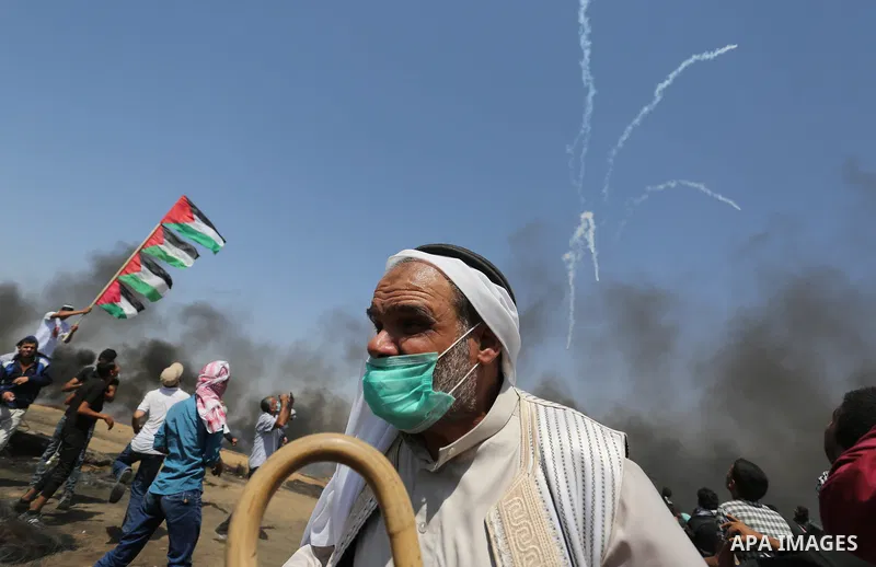 Palestinian protesters gather during clashes with Israeli troops in a protest marking al-Quds Day, (Jerusalem Day), at the Israel-Gaza border in Khan Younis in the southern Gaza Strip on June 8, 2018. Photo by Ashraf Amr...